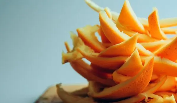 Cleaning the microwave with orange